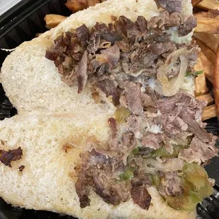 Half of a sad Philly Cheesesteak
