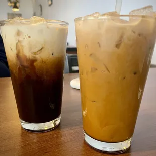 Ice coffee. One with cream mixed the other before mixed