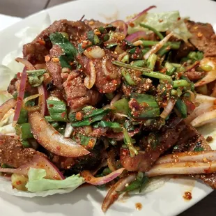 Spicy grilled pork sholder (yum kaw moo yang nam dok)