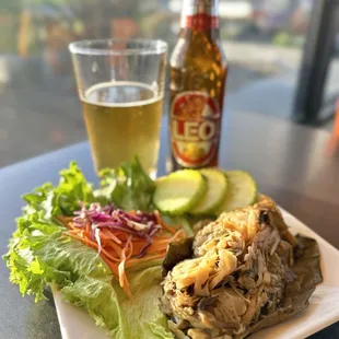 a plate of food and a beer