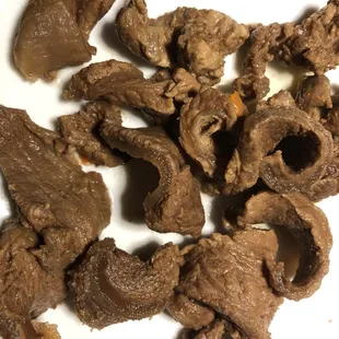 Disgusting, tough, rubbery, curled-up meat-like substance.  even be sure it&apos;s  beef.