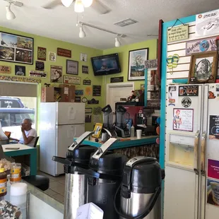 a coffee shop with a car in the background