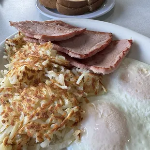 Now that's a breakfast - - eggs, ham hashbrowns and toast