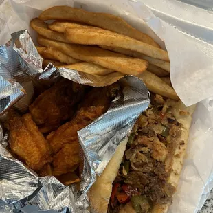 1/2 sub (mixed), fries, buffalo wings. Excuse the wrinkly wing, took it to go on a long drive.