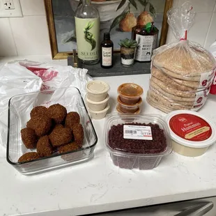 Dozen falafel and sauces from Zad plus pita, hummus, and barberries from their market next door.