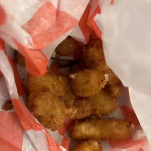 a basket of fried chicken nuggies