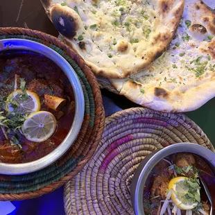 Mutton Kadhai (left) Chicken Achari (right) Chili garlic naan