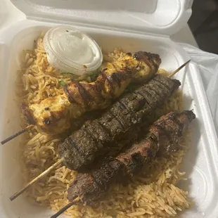 Beef kebab, chicken kebab and lamb kebab with Afghan Rice.