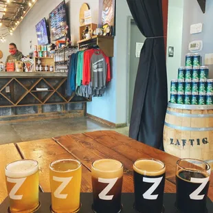 Custom Beer flights - Cart Path Kolsch, Hazy Miss Daisy, Nitro A-crop blacklight, Nuts for you and Rugger coffee