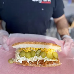 a man holding a sandwich