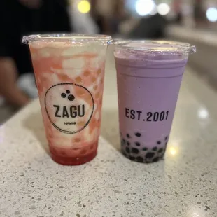 two cups of bubble tea on a table