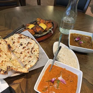 Garlic naan  Chicken tandoori  Goat curry Lamb tikki masala  Rice
