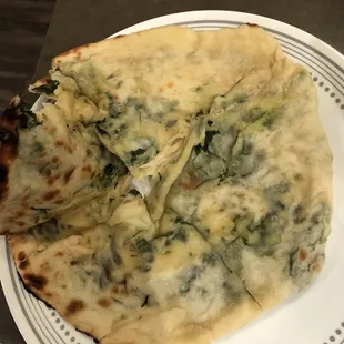Frozen and barely cooked Palak Cheese Kulcha