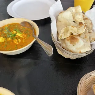 a bowl of soup and pita bread