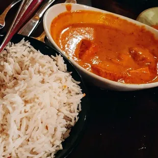 a bowl of rice and a bowl of curry