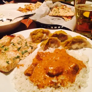 Lamb Rogan Josh with chicken momo and garlic naan.