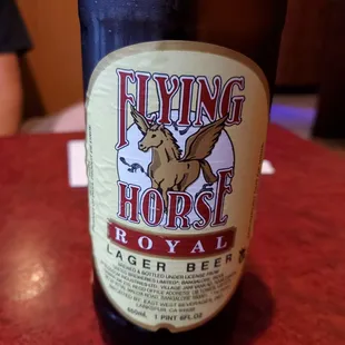 a bottle of flying horse royal ale