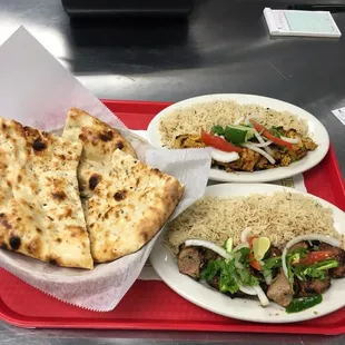 Lamb Tikka and Chicken Tikka with Rice salad and, Naan Bread.