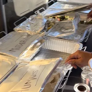 Cold dishes then hot dishes in the line up. I didn&apos;t get to take pictures of all the food once it was all set up in the trays.