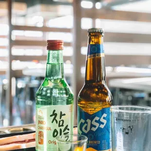 a bottle of beer and a plate of food