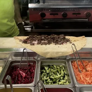 Steak Saj being prepared