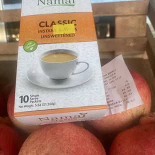 Instant Chai Tea posing with fruits in front.