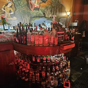a bar filled with bottles of alcohol