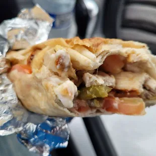 Taking a bite of my chicken shawarma