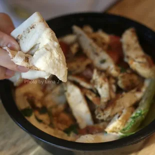 Close up of hummus in Hummus Bi Shawarma Specialty ($14.95) - w chicken shawarma. Hummus is excellent