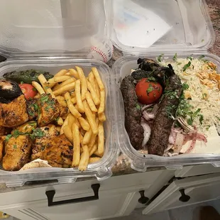 Shush Tawook (chicken) platter with fries, Kofta Kebab platter w/ rice. Side salad included but not pictured