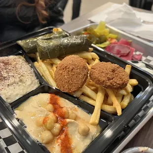 Vegetarian platter: Falafel, hummus, baba ganoush, dolma, and double fries and pita,