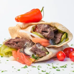 a pita with meat and vegetables