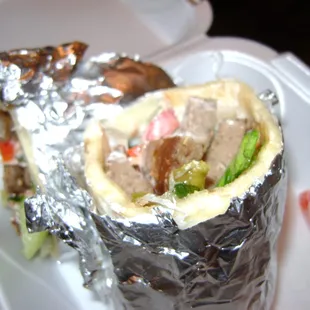 a burrito wrapped in aluminum foil