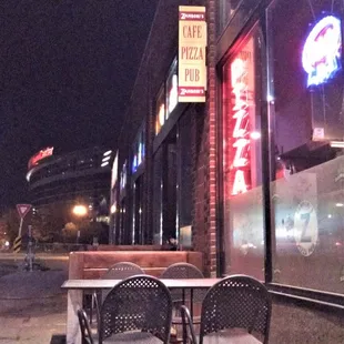 View from the outdoor table on the sidewalk on 7th out front, looking back toward downtown St. Paul and Xcel Center (that curved building).