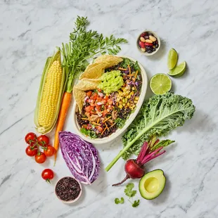 a variety of fresh vegetables on a marble surface