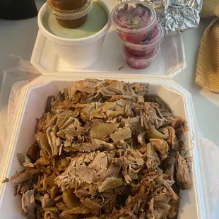 3lbs of Mix Carnitas a lil bit of everything, 2 dozen tortillas, Pickled red onion, Avocado salsa, and some red salsa as well!