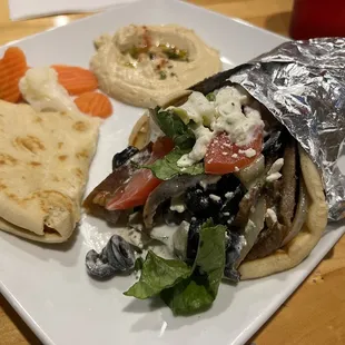 Gyro wrap supreme with side of hummus.