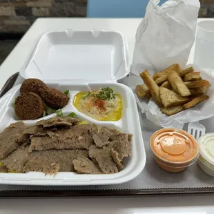 This is picture of the gyro plate with falafel and hummus sides and puts chips from a previous visit.
