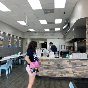 a woman standing at the counter