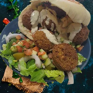 Falafel Pita
Chickpeas blended w/ herbs and spices then fried. Stuffed into homemade pita w/ homuss, lettuce, tomato, onion, pickle, tahini