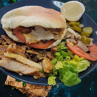 Chicken Shawarma Pita
Chicken breast and thigh, marinated overnight in our secret dry rub, then slow roasted. Stuffed into homemade pita