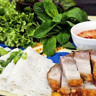 Crispy pork belly, roasted daily, served with rice vermicelli and lettuce