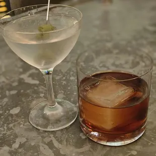 a drink and a martini on a table