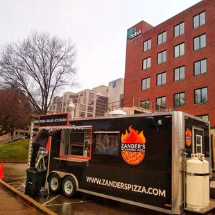 a food truck parked in front of a building