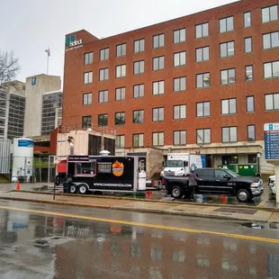 two trucks parked in front of a building