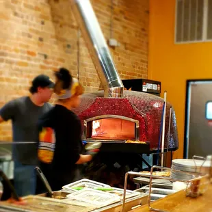 two people working in a kitchen