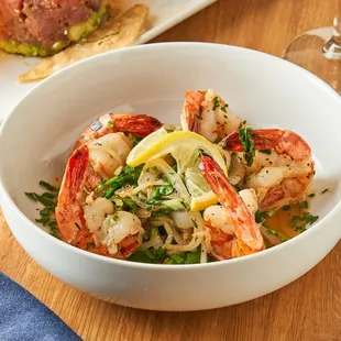 a bowl of shrimp and vegetables