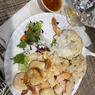 a plate of shrimp and rice