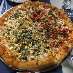 Paneer tikka and chicken tikka half half x large pizza