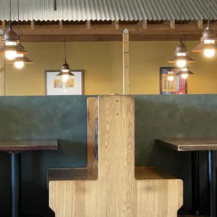 a wooden bench in a restaurant